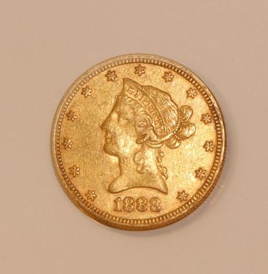 an image of a gold coin with a woman ' s head on it