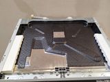 a broken computer sitting on top of a table