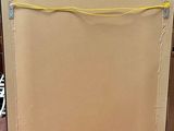a picture of a cardboard box with a yellow cord