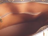 the inside of a louis vuitton bag with a zipper open