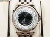 a silver watch with a black face and a silver bracelet