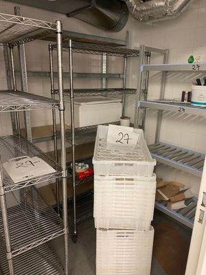 a refrigerator that has a lot of shelves in it