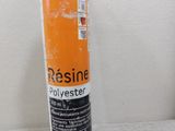 an image of a bottle of dessine polyesterer sitting on a couch