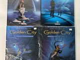 four golden city books on a white surface