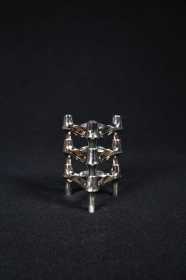 Fritz NAGEL (XXème). Trois candélabres de table en métal chr…