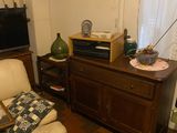 a living room with a couch and a television on a stand