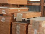 many stacks of wooden boards stacked on top of each other