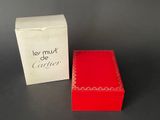 a red box and a white box on a table