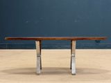 an image of a wooden table with metal legs on a wooden floor