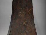 an old wooden shoe with a hole in the sole