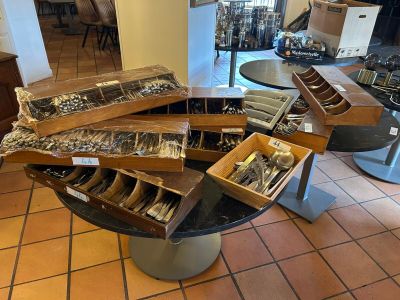 a table with a lot of silverware on it