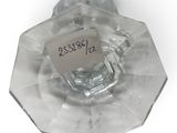 a clear glass vase with a label on it