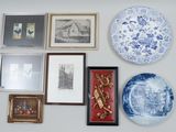 many plates and pictures on the wall of this room