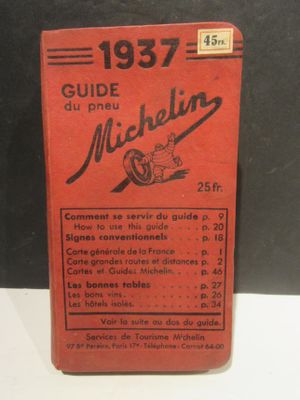 un vieux livre rouge dont le titre est « Guide de Michel »