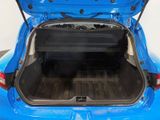 the back of a blue car with its trunk open showing the cargo compartment
