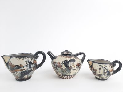 three different types of teapots sitting on a table
