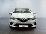 the front view of a white car parked in a showroom