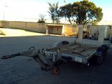 a trailer that is sitting in the middle of a parking lot
