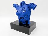 an image of a blue sculpture on a black stand