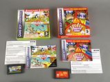 a game box with a game and several other items on it