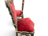 an image of a pair of chairs with red upholstered cushions