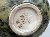 a close up of a vase with a number on it