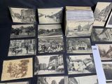 several old black and white photographs of buildings and buildings on a table