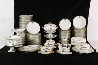 a lot of plates and bowls on a black table