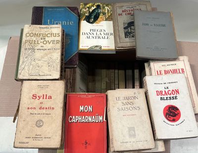 many books that are stacked on top of each other
