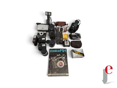 a lot of cameras and a book on the table