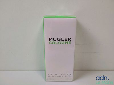 a close up of a bottle of cologne on a table