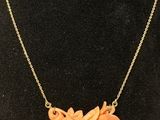 a necklace and earring set made of coral coral coral coral coral coral coral coral coral coral coral coral coral