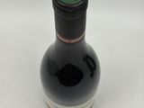 a bottle of wine that is sitting on a table
