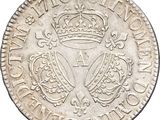 a silver coin with a crown on top of it