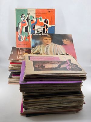 a lot of records stacked on top of each other