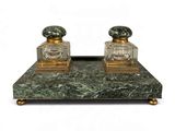 pair of green marble and brass perfume bottles on a stand