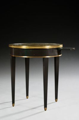 an image of a black and gold side table on a white surface