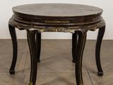 an image of a round table with a wooden top on a wooden floor