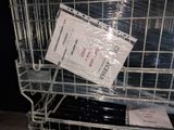 a shopping cart with a lot of plastic bags on it