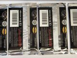 four packages of chocolates are sitting on a table in a box