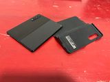 a couple of black cases sitting on top of a red table
