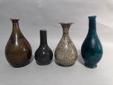three vases sitting next to each other on a table