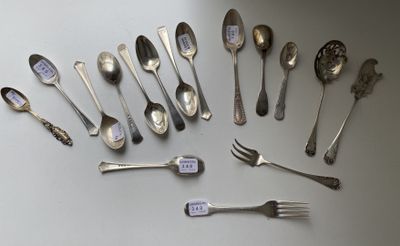 a lot of silver spoons and forks on the table
