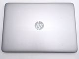 a laptop that is sitting on a white table