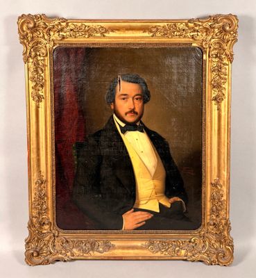 portrait of a man in a tuxedo in a gold frame