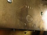 a close up of a clock with a metal case