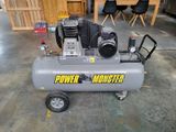 an air compressor sitting on top of a cart in a room