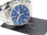 an image of a stainless steel wrist watch with a blue dial
