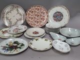 many plates and bowls that are sitting on a table
