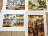 three paintings of a river and a house in the woods
